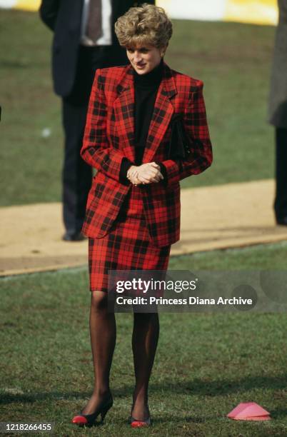 Diana, Princess of Wales visits the St Helen's Rugby Club in Swansea, Wales, 20th February 1992. She is wearing a red and black tartan suit.