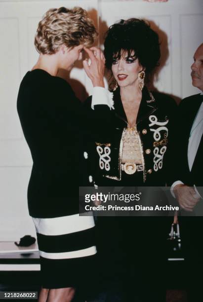 Diana, Princess of Wales with actress Joan Collins during a tribute concert to Sammy Davis Jr at the Royal Albert Hall in London, 23rd June 1992.