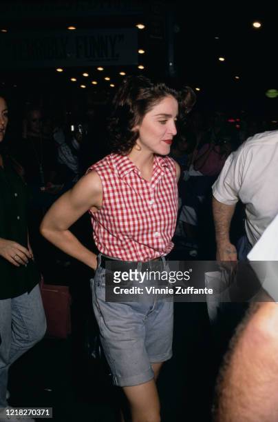 American singer and actress Madonna leaves the theatre whilst starring in the David Mamet play 'Speed-the-Plow' on Broadway, New York City, 1988. The...