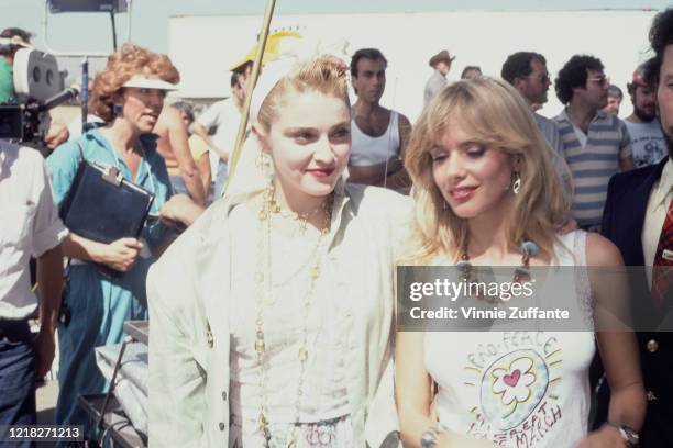 American singer and actress Madonna with actress Rosanna Arquette during a Pro-Peace rally in Van Nuys, Los Angeles, California, 5th October 1985.