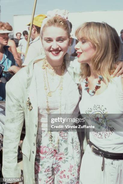 American singer and actress Madonna with actress Rosanna Arquette during a Pro-Peace rally in Van Nuys, Los Angeles, California, 5th October 1985.