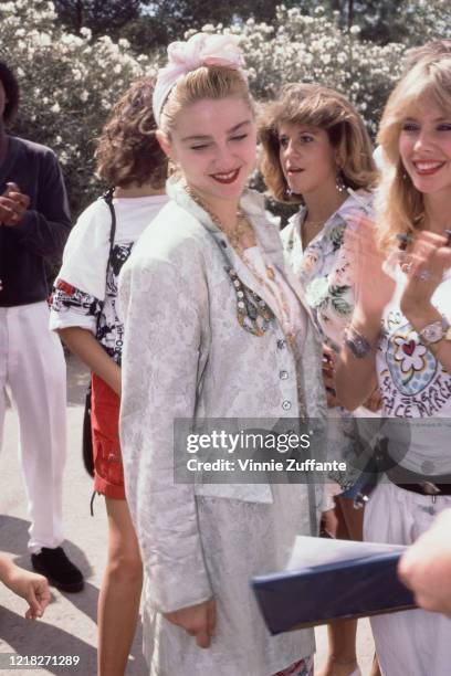 American singer and actress Madonna with actress Rosanna Arquette during a Pro-Peace rally in Van Nuys, Los Angeles, California, 5th October 1985.