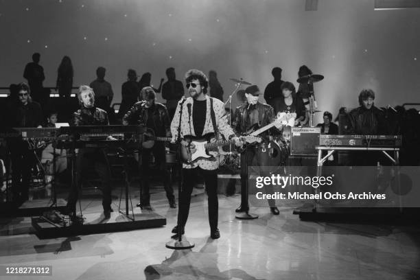 English rock band Electric Light Orchestra or ELO perform on the television show 'American Bandstand', USA, 5th July 1986. From left to right, Louis...