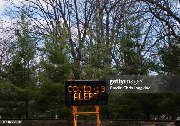 roadside sign reading "covid-19 alert" - social distancing 6 feet stock pictures, royalty-free photos & images