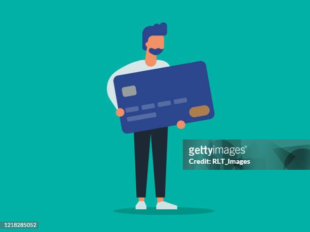 illustration eines jungen mannes mit riesiger kreditkarte - credit card purchase stock-grafiken, -clipart, -cartoons und -symbole
