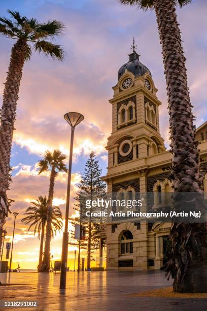 sunset view of the glenelg town hall at moseley square, holdfast bay in gulf st vincent, adelaide, south australia - adelaide fotografías e imágenes de stock