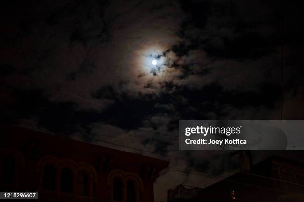 moonbow - moon ringed in clouds at night - moonbow stock pictures, royalty-free photos & images