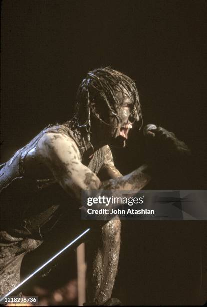 Singer Trent Reznor is shown performing on stage with Nine Inch Nails at Woodstock 94 on August 13, 1994.