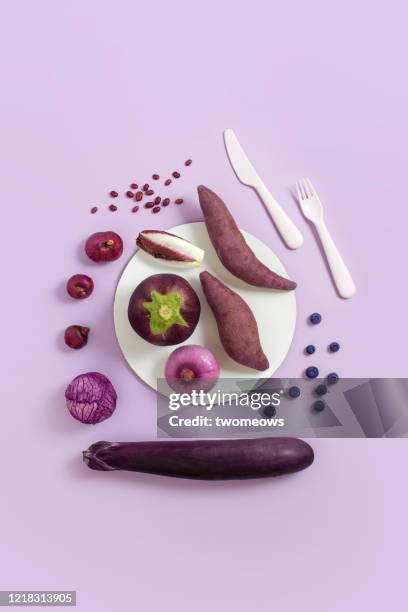 purple colour vegan food still life image. - cut cabbage stock pictures, royalty-free photos & images