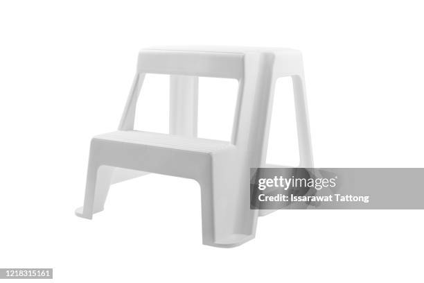 white stool stand  on white background - step ladder stock-fotos und bilder