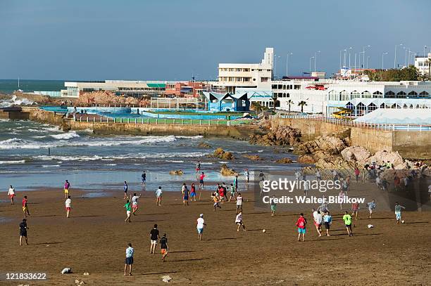 along ain diab beach, resort hotels & soccer game, casablanca, atlantic coast, morocco - モロッコ カサブランカ ストックフォトと画像