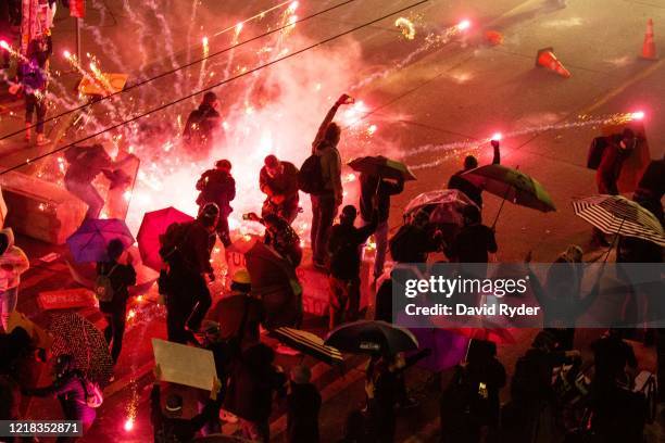 Demonstrators clash with police near the Seattle Police Departments East Precinct on June 7, 2020 in Seattle, Washington. Earlier in the evening, a...