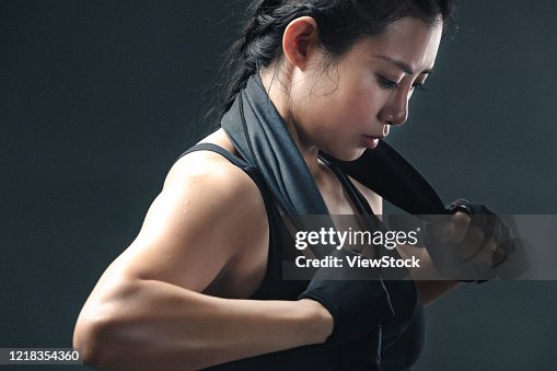 Fitness of young women think about taking a towel - stock photo