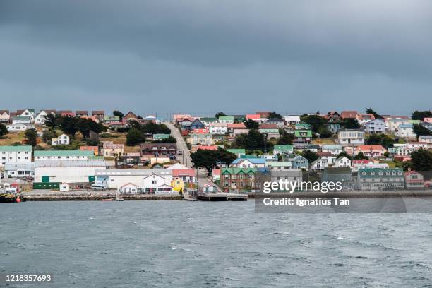 view of stanley, falkland islands from stanley harbour - falklandeilanden stockfoto's en -beelden