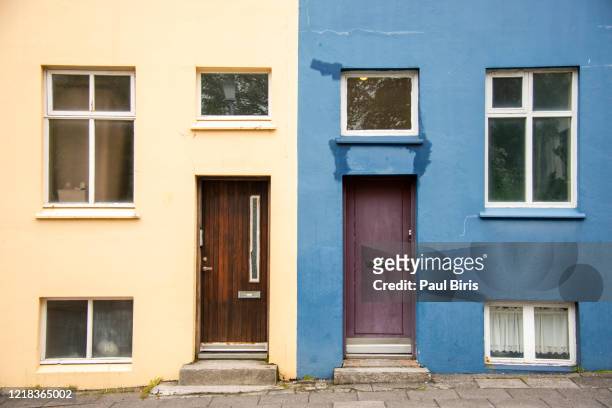 multi-coloured houses in reykjavik, iceland - blue house red door stock pictures, royalty-free photos & images