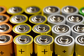 Closeup of a lot of color AA batteries