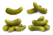 Collection of delicious marinated cucumbers on white
