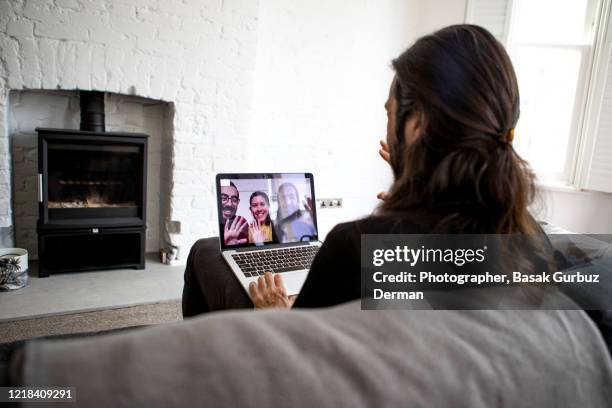 teleconference / video conference with friends - lockdown stock pictures, royalty-free photos & images