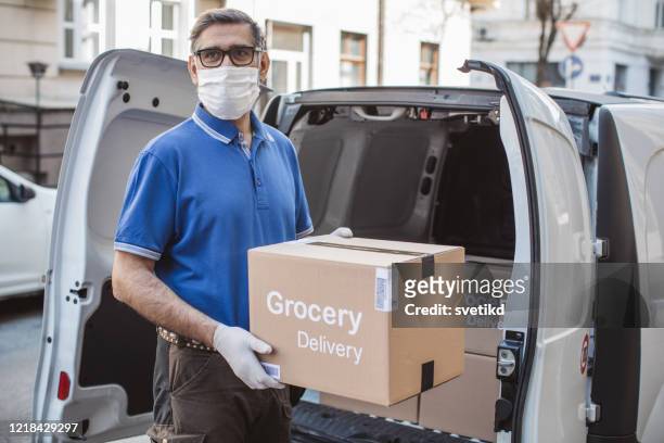 food delivering at home address with car - covid 19 food stock pictures, royalty-free photos & images