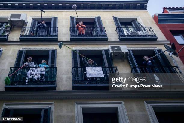 Neighbors of the Madrid neighborhood of Lavapies, perform the 'Fregonada de Lavapies', a gesture that consists of waving mops from their balconies to...