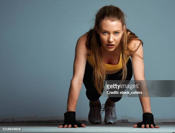 fit blond woman working out, doing push ups - beautiful romanian women stock pictures, royalty-free photos & images