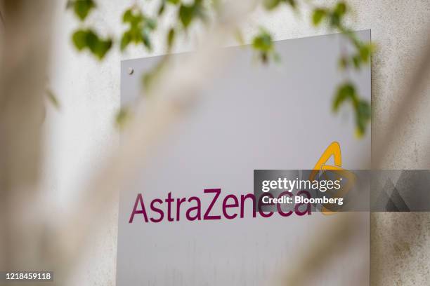 Sign featuring the AstraZeneca Plc logo stands at the company's DaVinci building at the Melbourn Science Park in Cambridge, U.K., on Monday, June 8,...