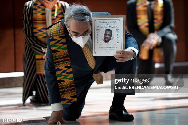 Rep. G.K. Butterfield and other Democratic lawmakers take a knee to observe a moment of silence on Capitol Hill for George Floyd and other victims of...