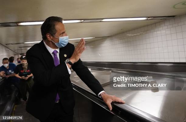 New York Governor Andrew Cuomo takes the escalator after riding the New York City subway 7 train into the city on June 8, 2020 in New York. - Today...