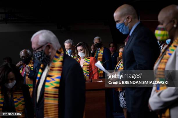 Speaker of the House Nancy Pelosi and Senate Minority Leader Charles E. Schumer arrive with other Democrats to announce police reform legislation in...