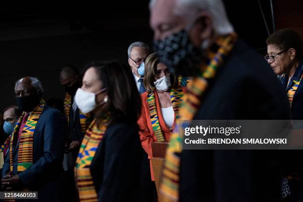 Speaker of the House Nancy Pelosi and Senate Minority Leader Charles E. Schumer arrive with other Democrats to announce police reform legislation in...