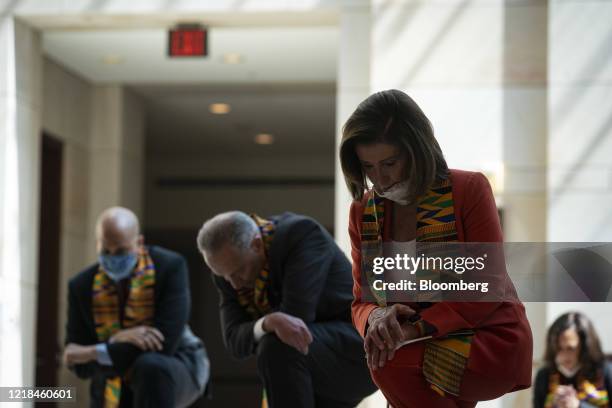 House Speaker Nancy Pelosi, a Democrat from California, and House and Senate Democrats bow their heads during a moment of silence in Emancipation...