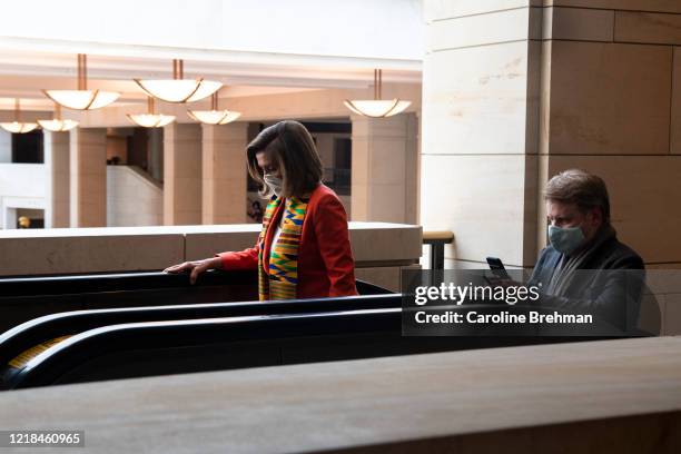 Speaker of the House Nancy Pelosi, D-Calif., left, departs from Emancipation Hall after taking moment of silence to honor George Floyd, and victims...