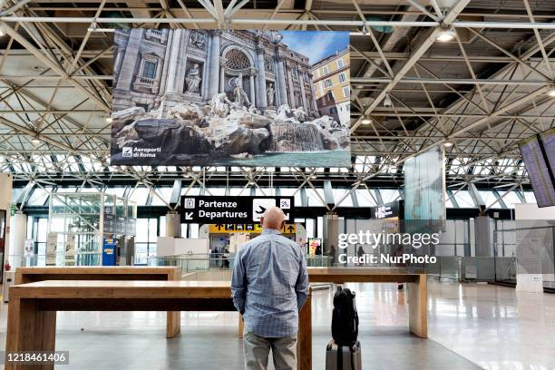 Treveller inside the international airport of Roma Leonardo Da Vinci. The airport is slowly come back to normality after the European Member states...