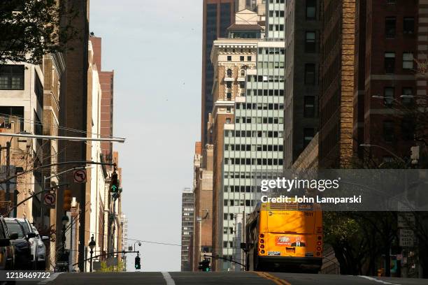 An out of service bus is parked on 34th Street amid the coronavirus pandemic on April 12, 2020 in New York City. COVID-19 has spread to most...