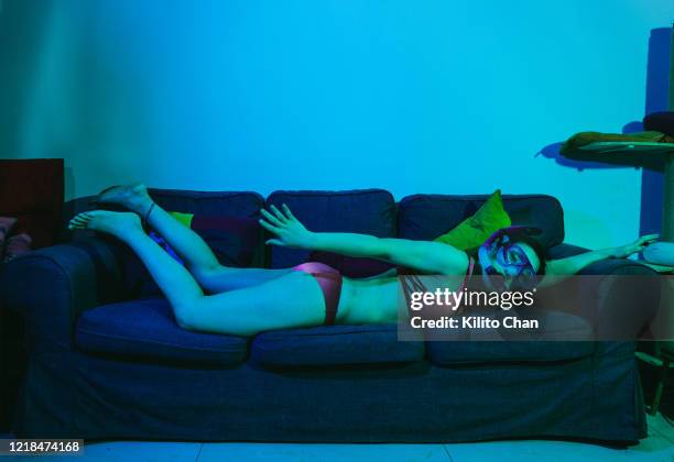 asian woman playing snorkeling in the living room - quarantine travel stock pictures, royalty-free photos & images