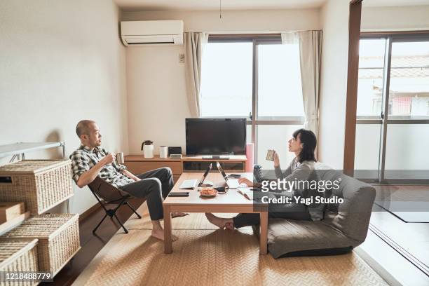 asian freelance couple working together at home - japanese room stock pictures, royalty-free photos & images