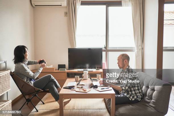 Asian freelance couple working together at home