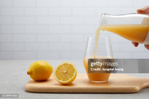 fresh fruit yellow lemon juice - lemon juice stock pictures, royalty-free photos & images