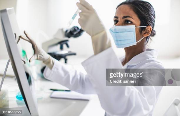 scientist working in the laboratory - research stock pictures, royalty-free photos & images