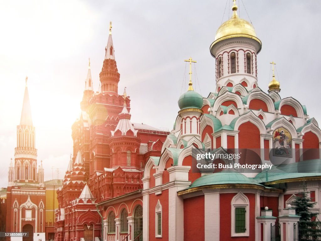 View of spectacular landmarks in Moscow's Red Square, including the Nikolskaya Tower, the State Historical Museum and the Kazan Cathedral. Moscow, Russia