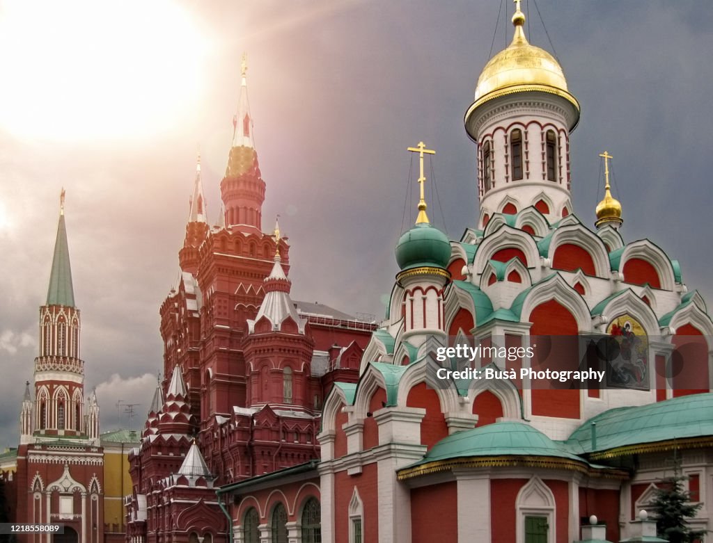 View of spectacular landmarks in Moscow's Red Square, including the Nikolskaya Tower, the State Historical Museum and the Kazan Cathedral. Moscow, Russia