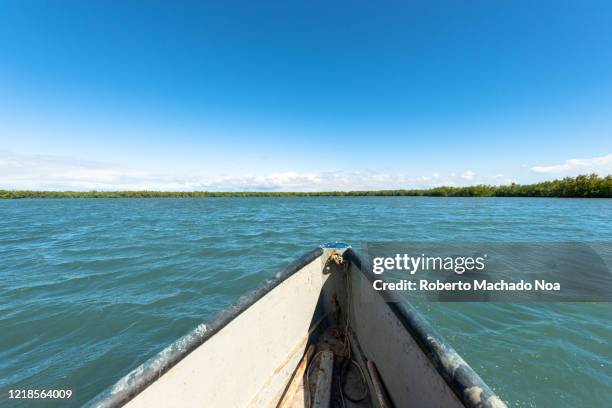 fishermen boat in river zaza, tunas de zaza, cuba - zaza stock pictures, royalty-free photos & images