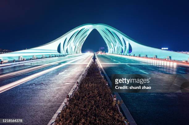 modern bridge structure after rain - qingdao bridge stock pictures, royalty-free photos & images