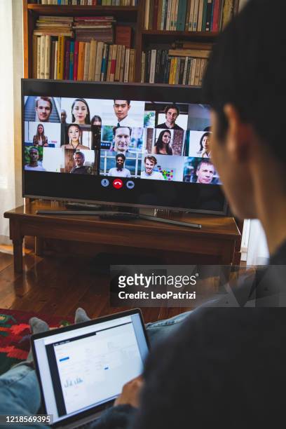 woman in front of a device screen in video conference for work - vertical tv stock pictures, royalty-free photos & images