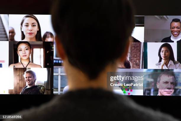 woman in front of a device screen in video conference for work - covid lockdown stock pictures, royalty-free photos & images