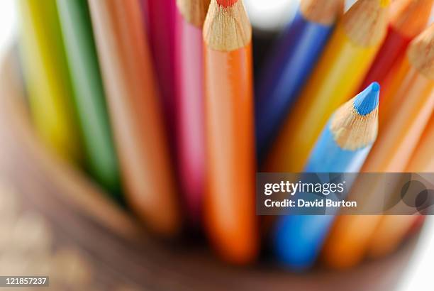 selection of coloured pencils in container - colored pencil foto e immagini stock