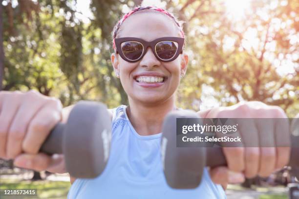 woman exercising outside in the park - clumsy walker stock pictures, royalty-free photos & images