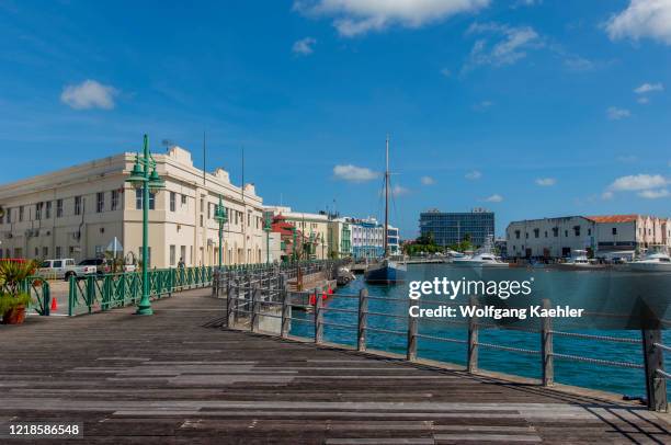 The boardwalk at the marina and the old warehouses at the Careenage Harbor in Bridgetown, the capital city of Barbados, an island in the Caribbean.