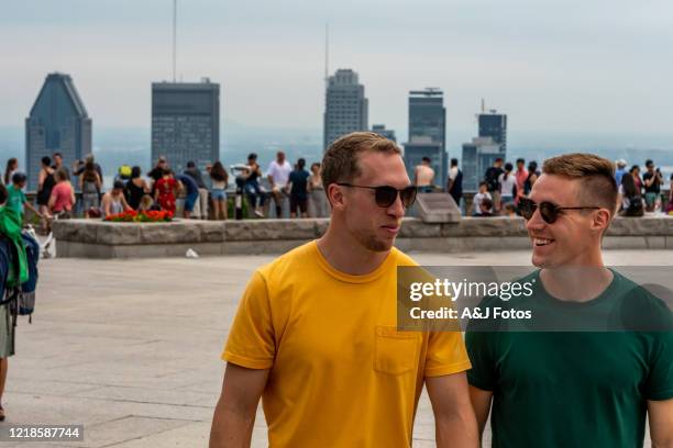 homosexual couple visiting montreal in summer. - long weekend canada stock pictures, royalty-free photos & images