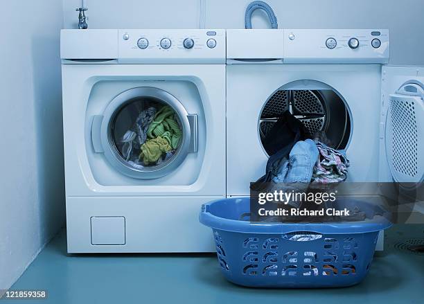 domestic energy waste: use of washing machine and tumble drier - dryer stock-fotos und bilder